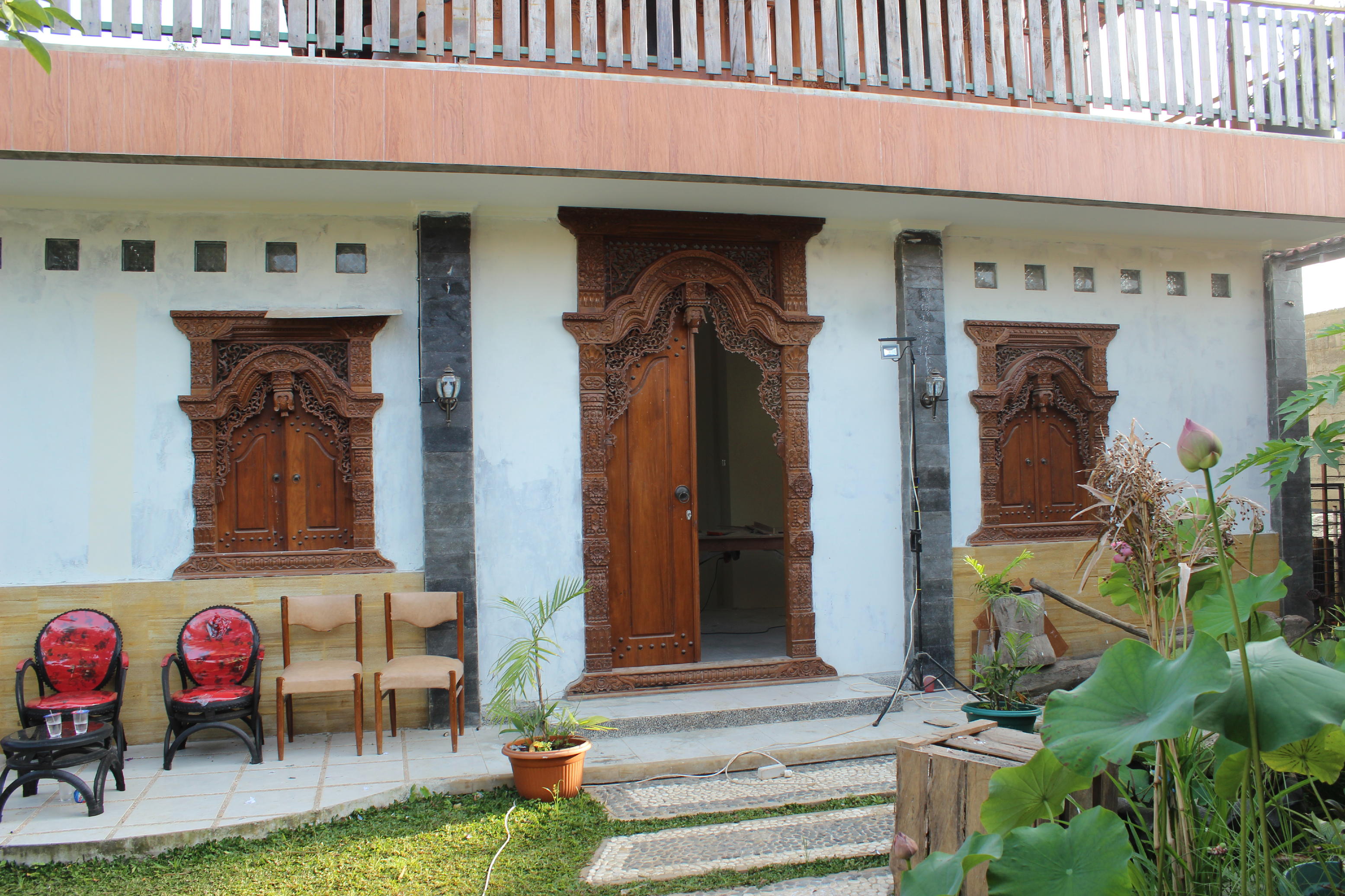Carved teak entrance installed in a residence