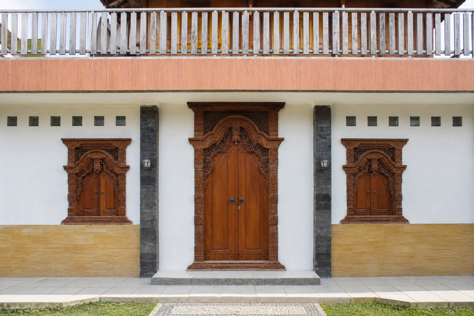 Carved teak entrance installed in a residence