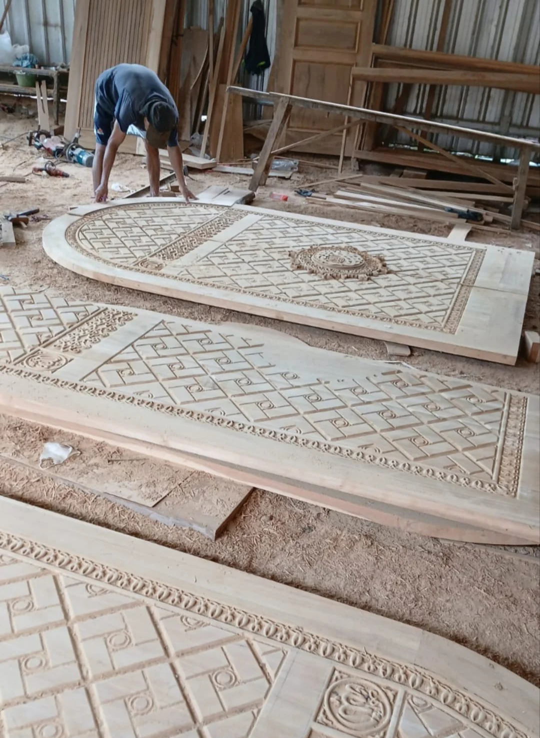Carved wall panels laid flat in the Tanarupa portfolio