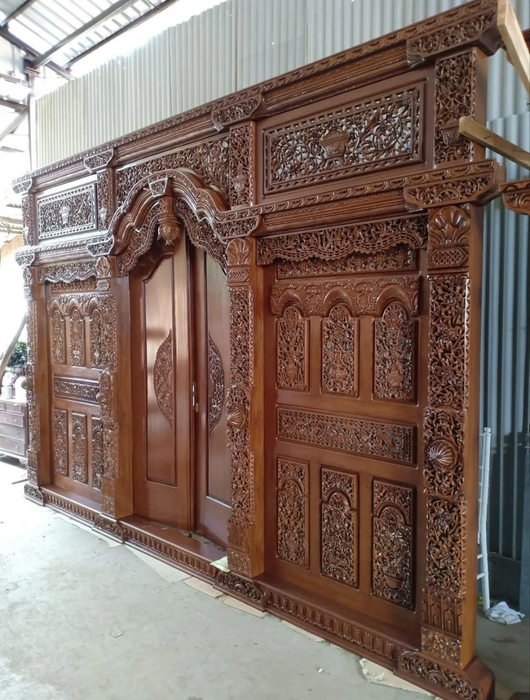 Dark carved portal at three-quarter view in the Tanarupa portfolio